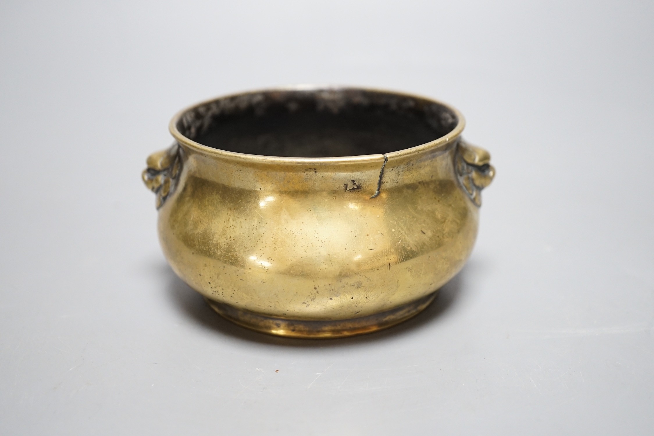 A Chinese bronze censer, Xuande mark, Qing period, 12cm handle to handle